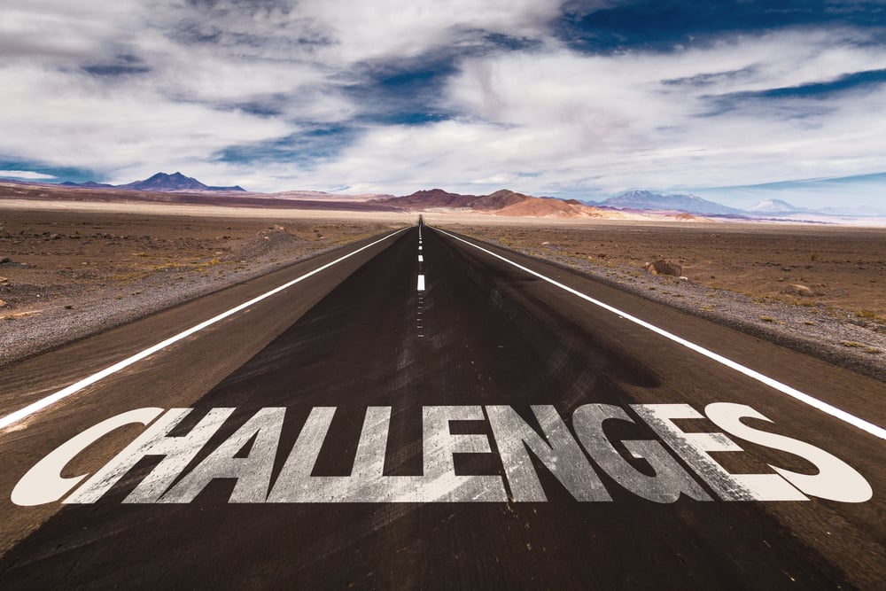 Challenges written on desert road